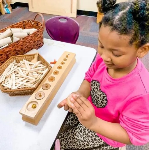 girl doing an activity on a table 