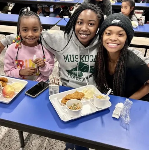 girls eating lunch in the cafeteria 