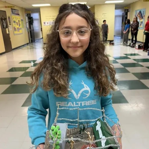 girl holding her project 