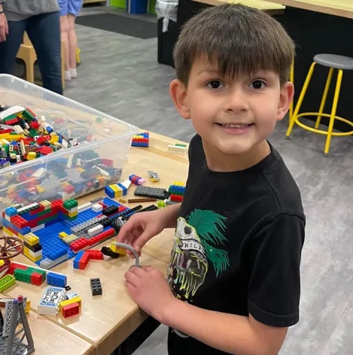 boy playing with toys in class