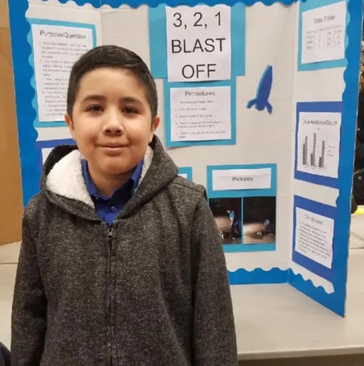 boy showing his project 