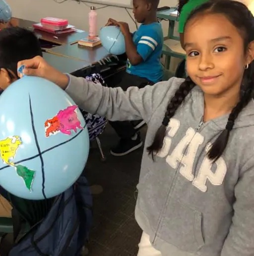 girl holding a balloon 