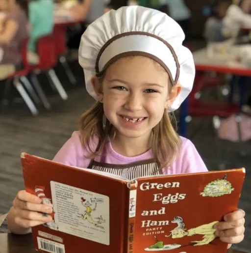 girl holding a cooking book 