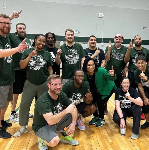 poeple gathered in the basketball court