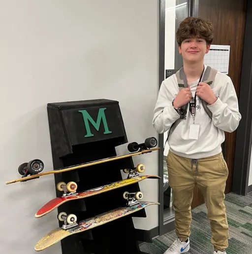 kid beside skateboards