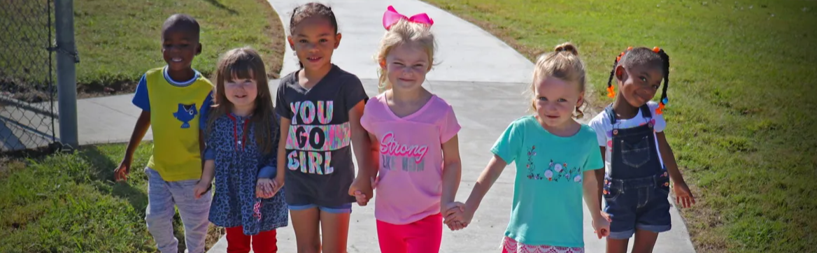 kids walking on the sidewalk