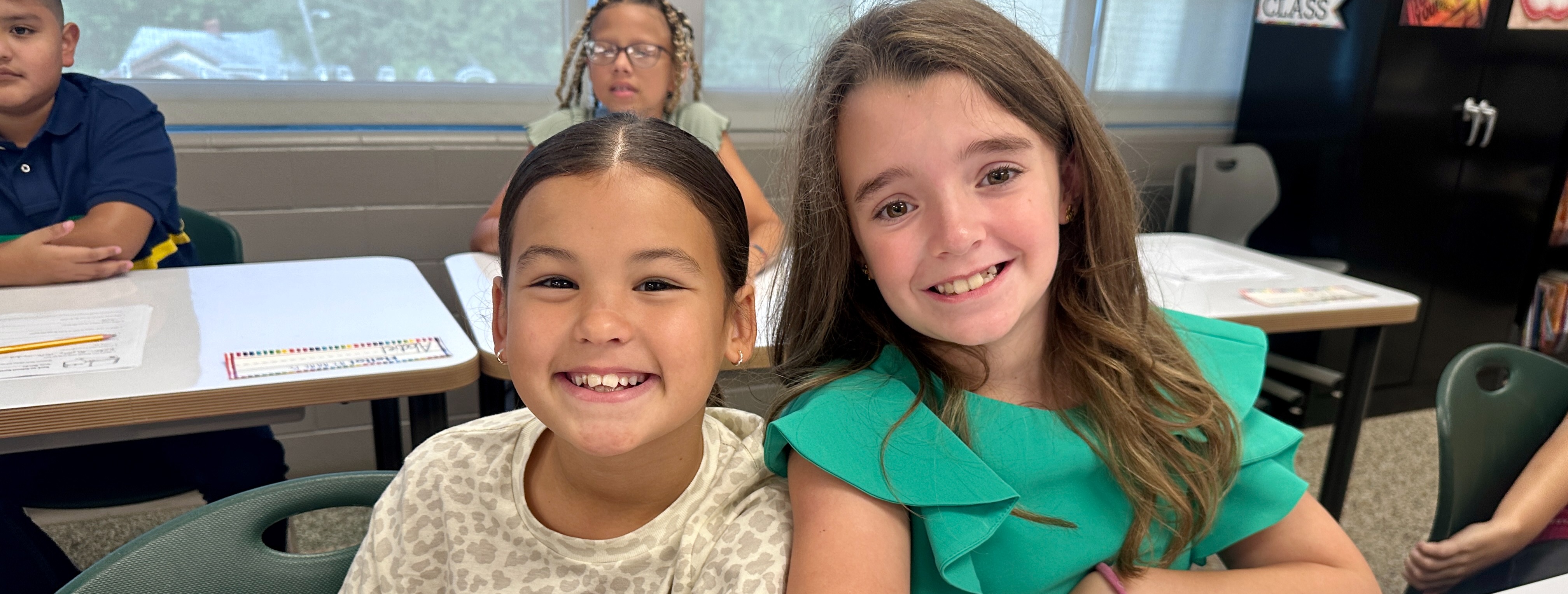 three students in the classroom