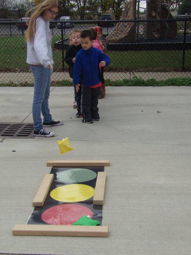 Preeschool students playing at school yard