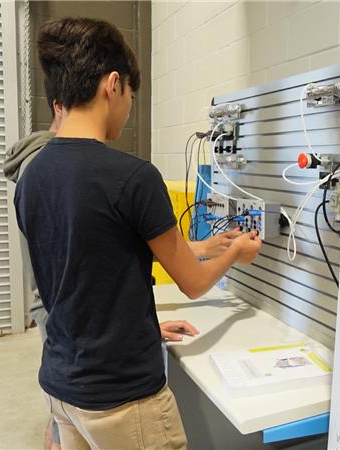 Student operates a switchboard