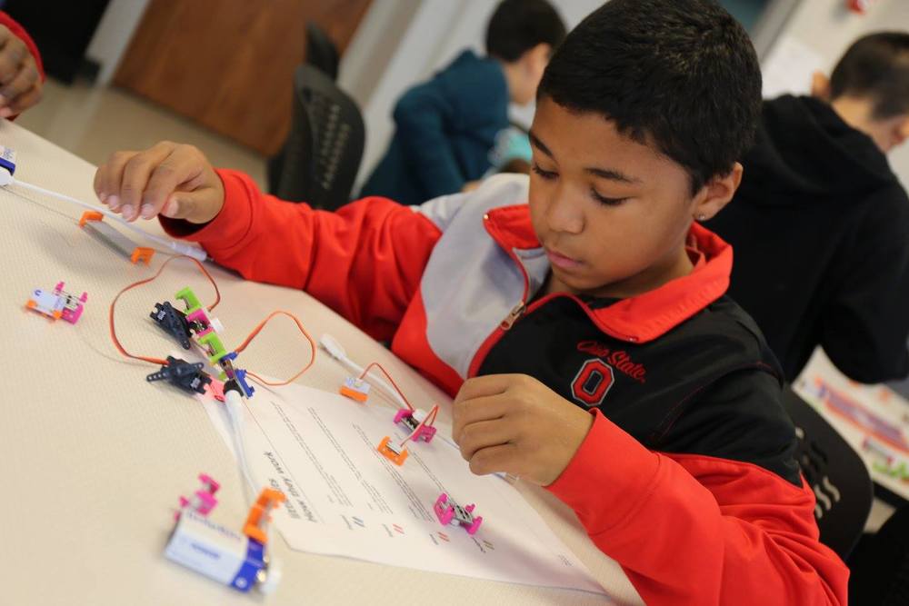 Kid building a robot