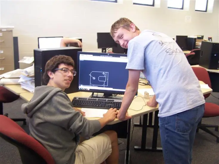 two students learning in the computer