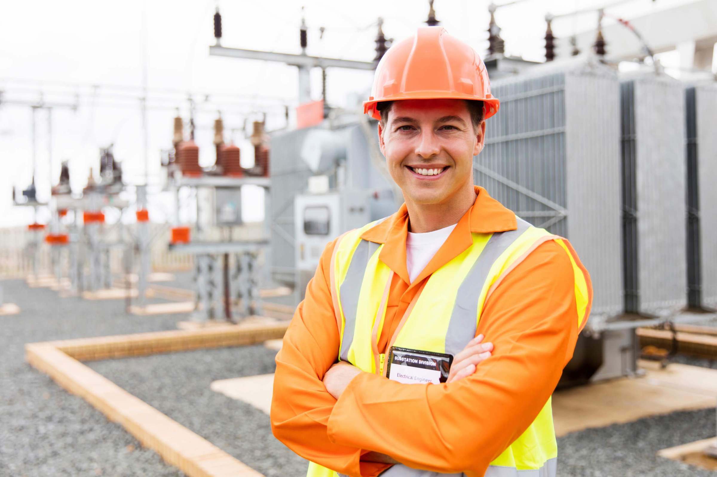 Man with helmet and uniform in an electrical site 
