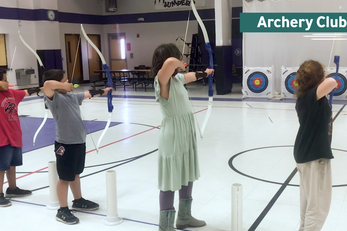Four students aiming arrows at targets