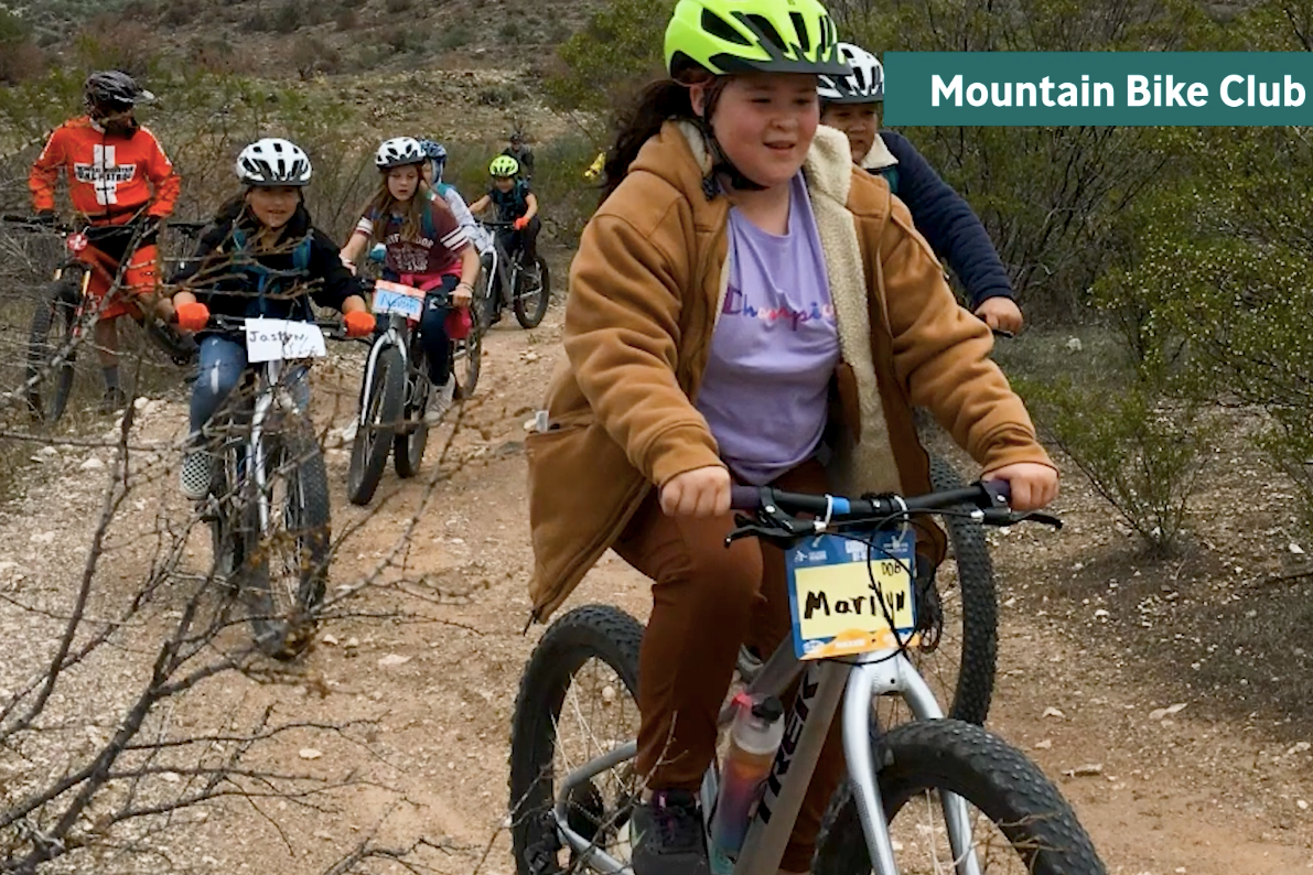 Students on mountain bikes on a trail