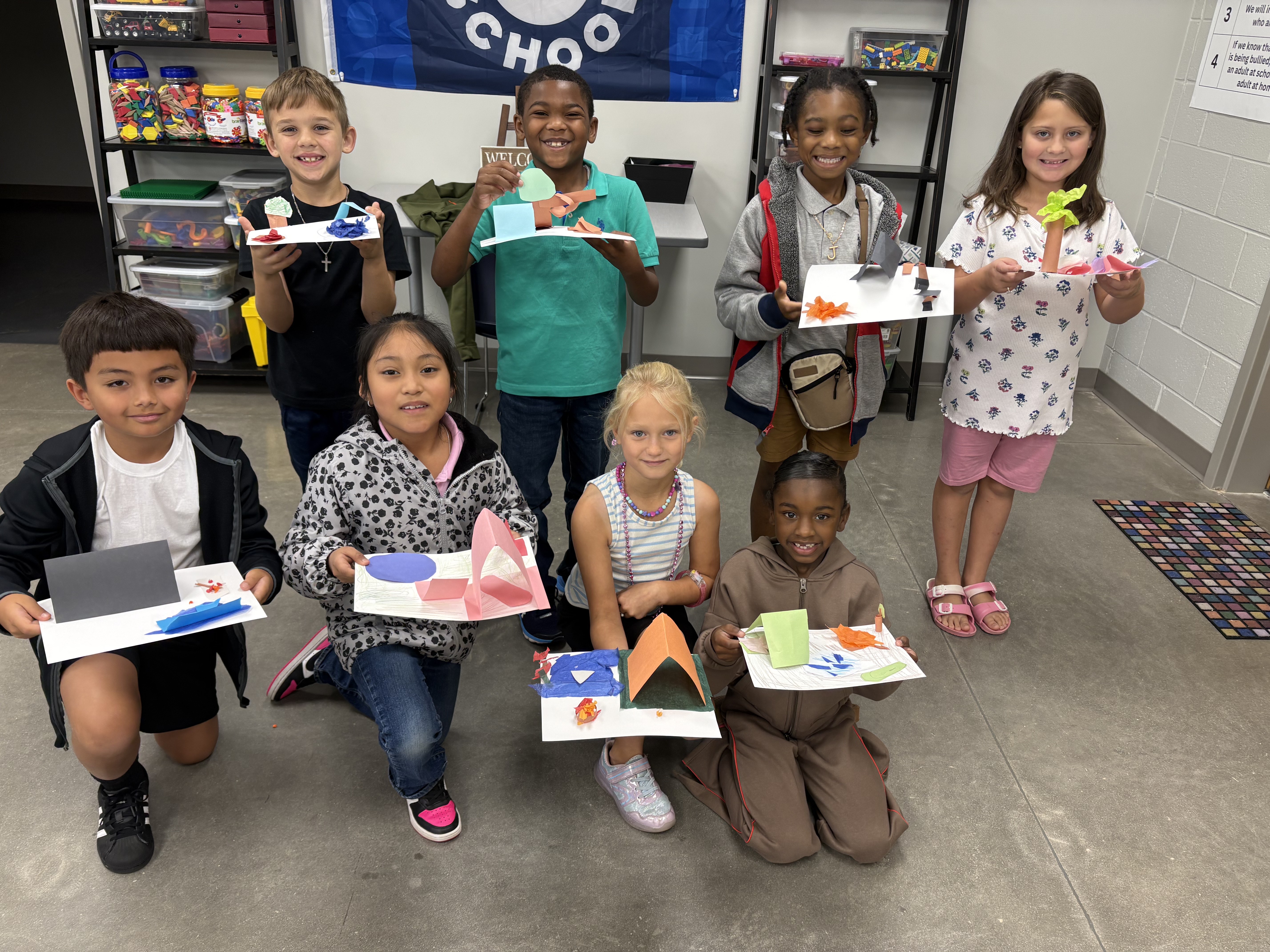 This is a picture of students in a STEM class showing of their projects.