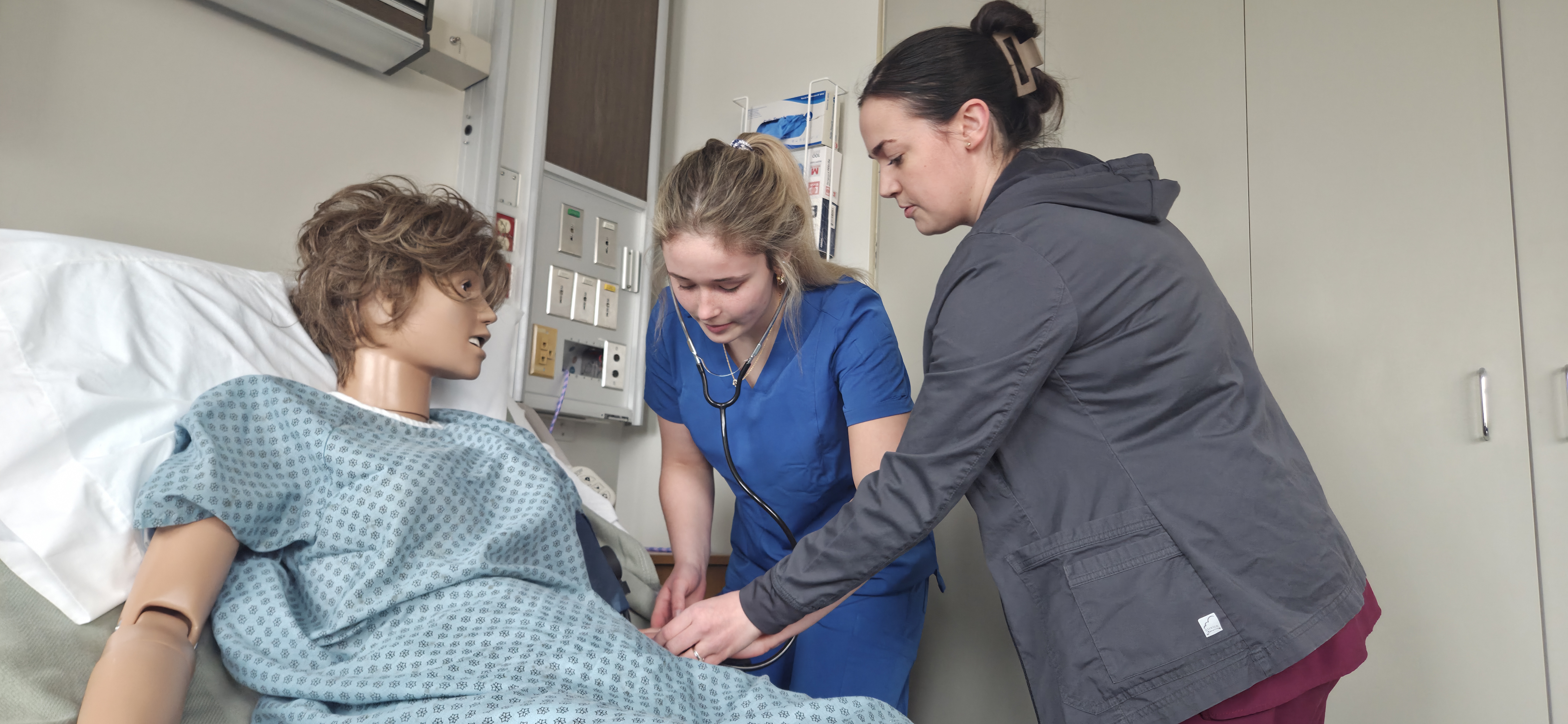 CCISD Health Careers student and teacher working on a mannequin