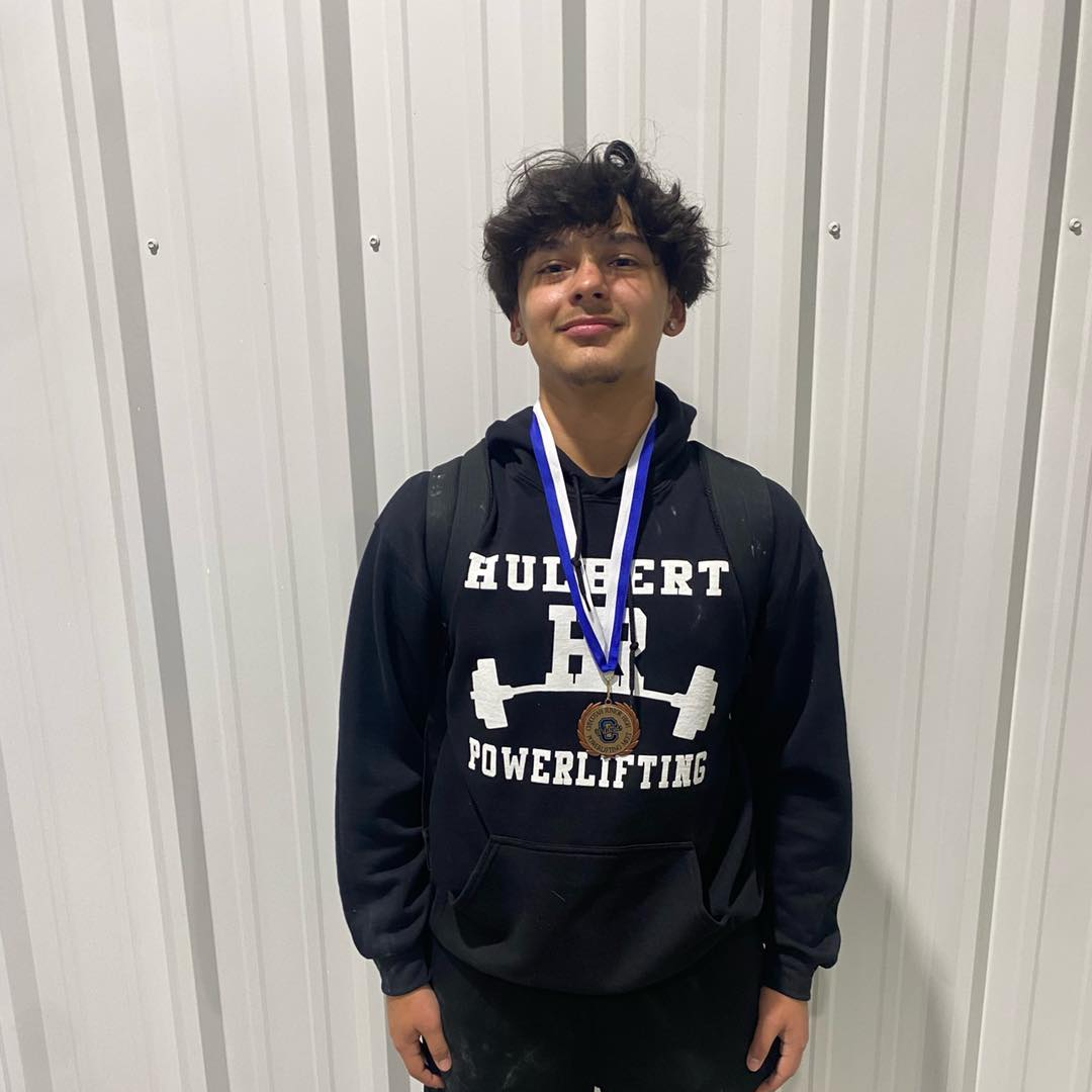 powerlifter with medal