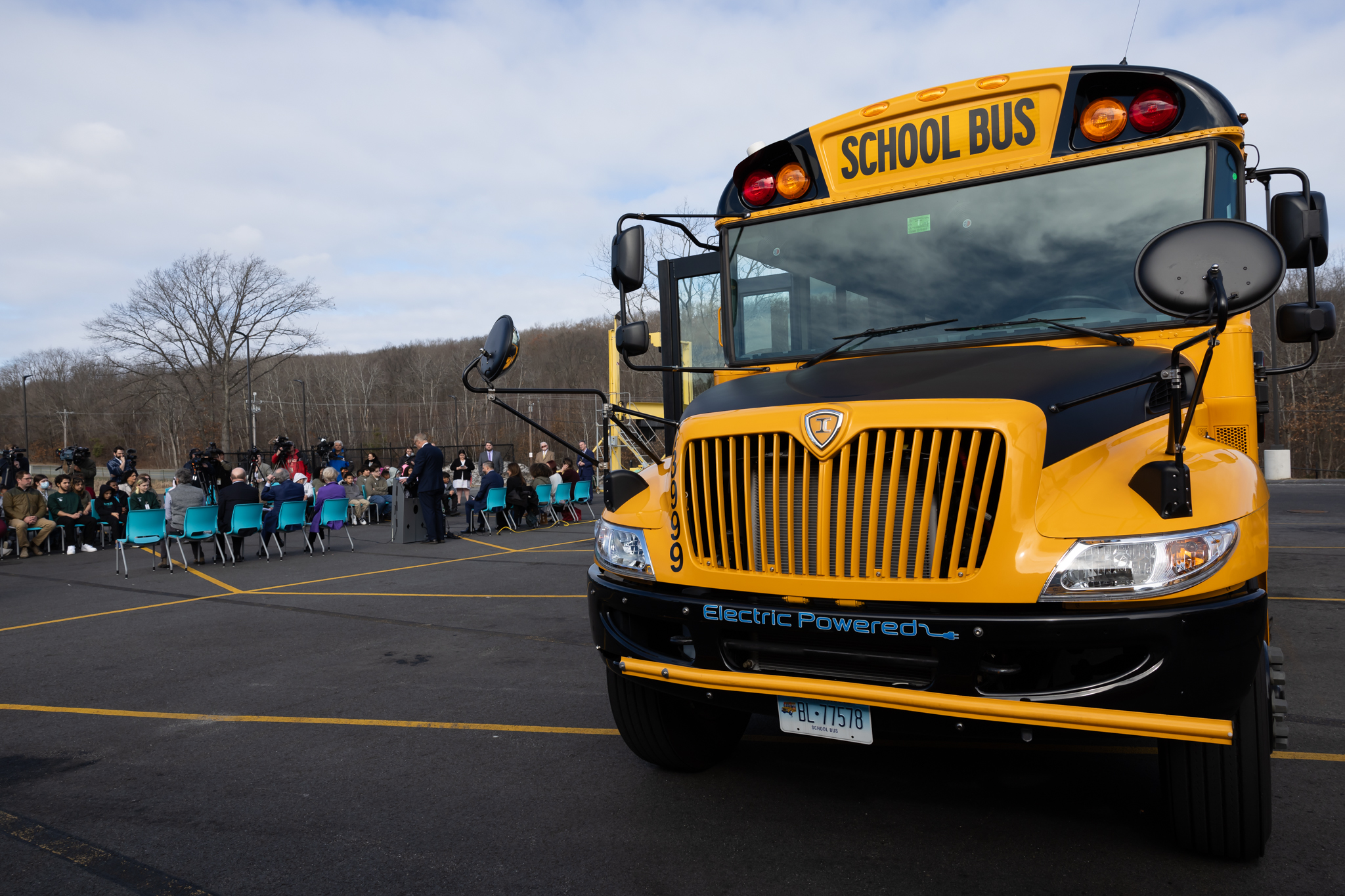 An electric school bus in a bus yard