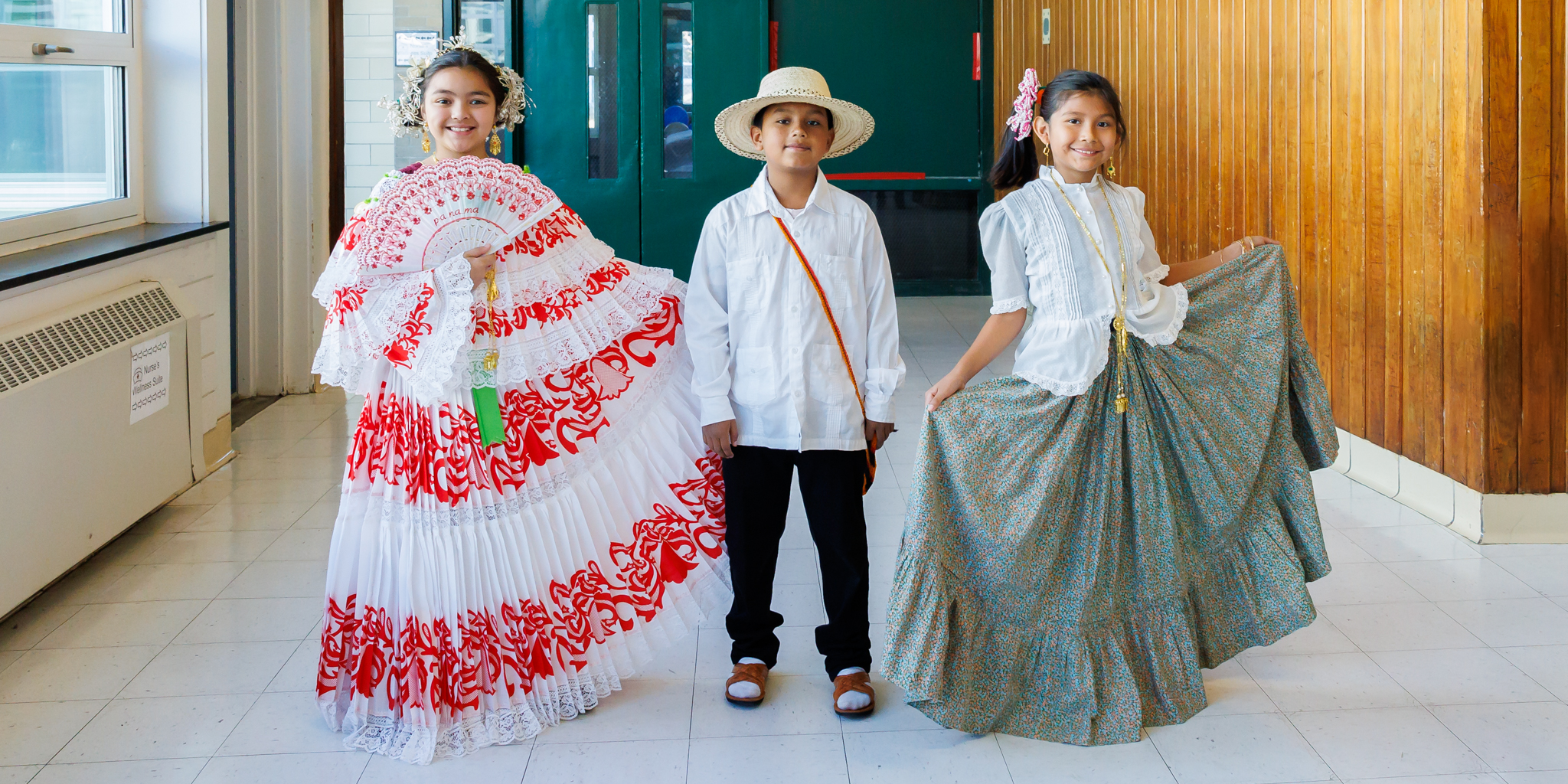 Three students from Worcester Dual Language Magnet School dressed in hispanic clothing.