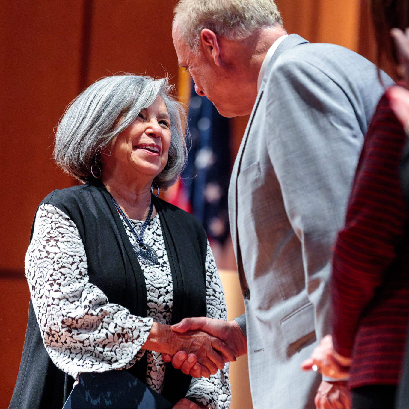 A teacher accepts an award during the Evening of Innovation.