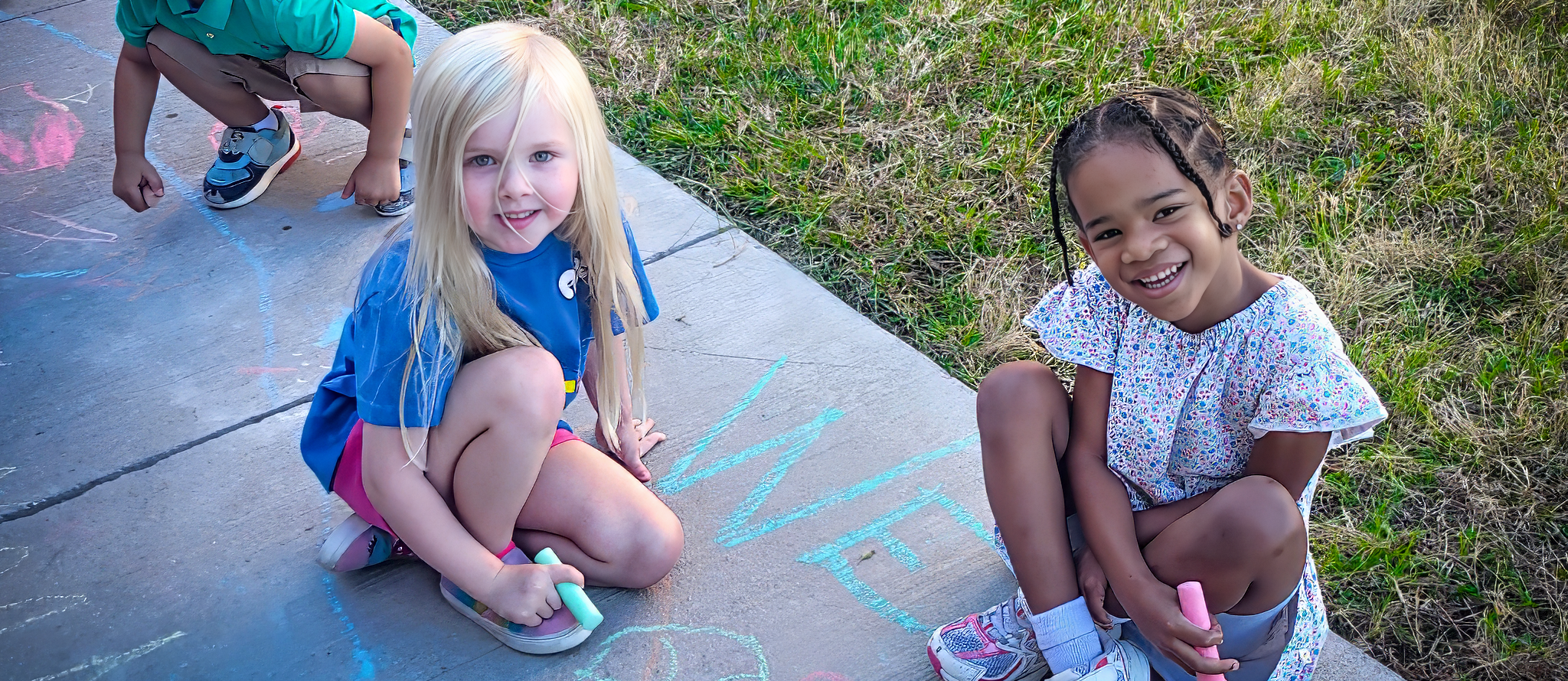 Mae Stevens students doing sidewalk art
