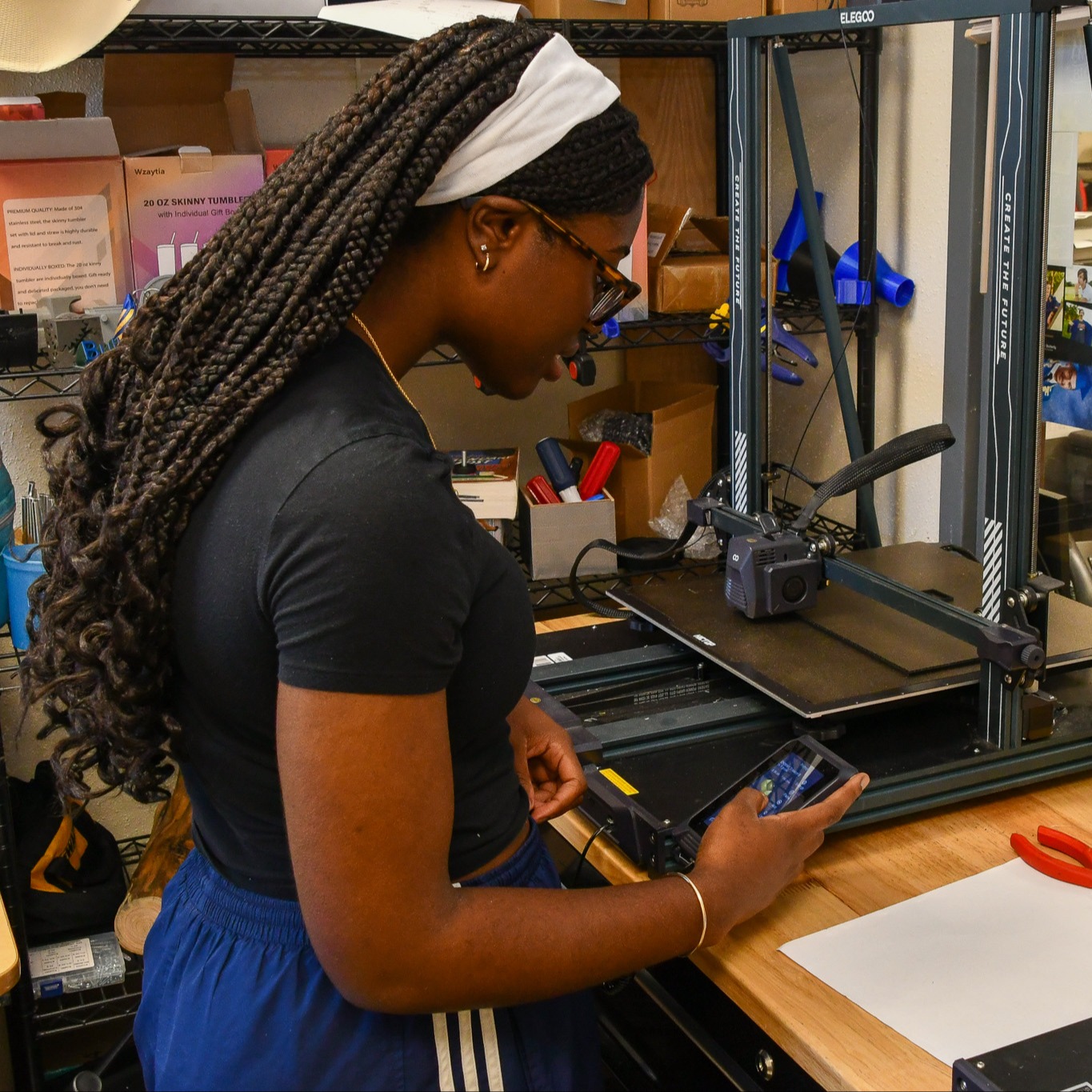 Student measuring in construction lab