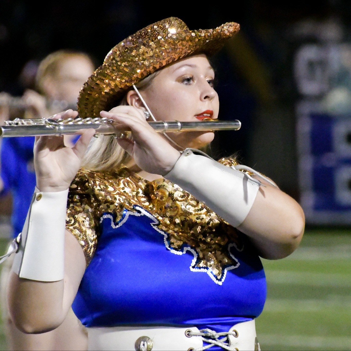 Flute player in marching band formation