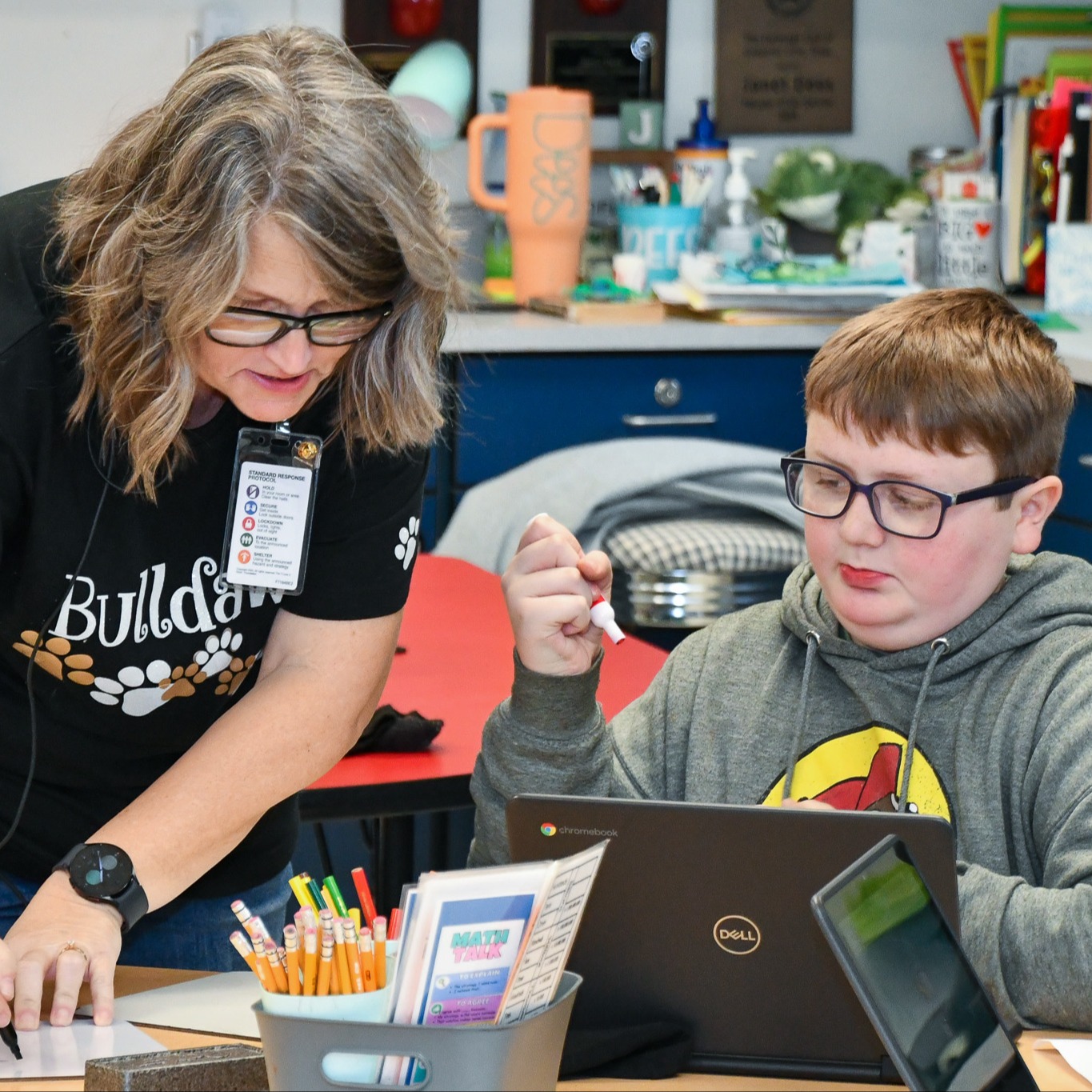 Teacher helping student on activity