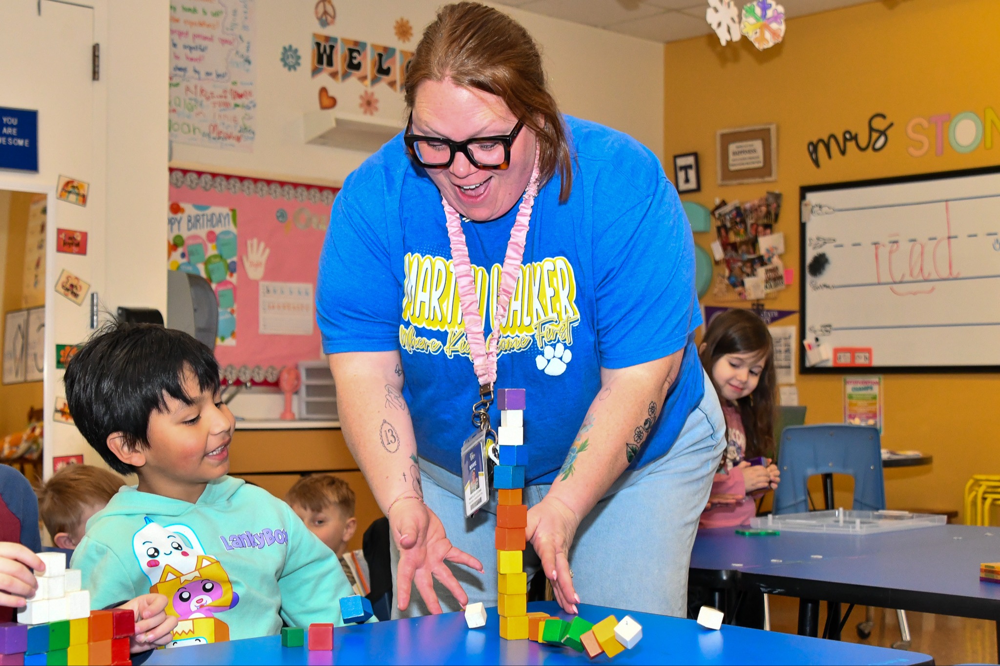 Teacher and student smiling during an activity
