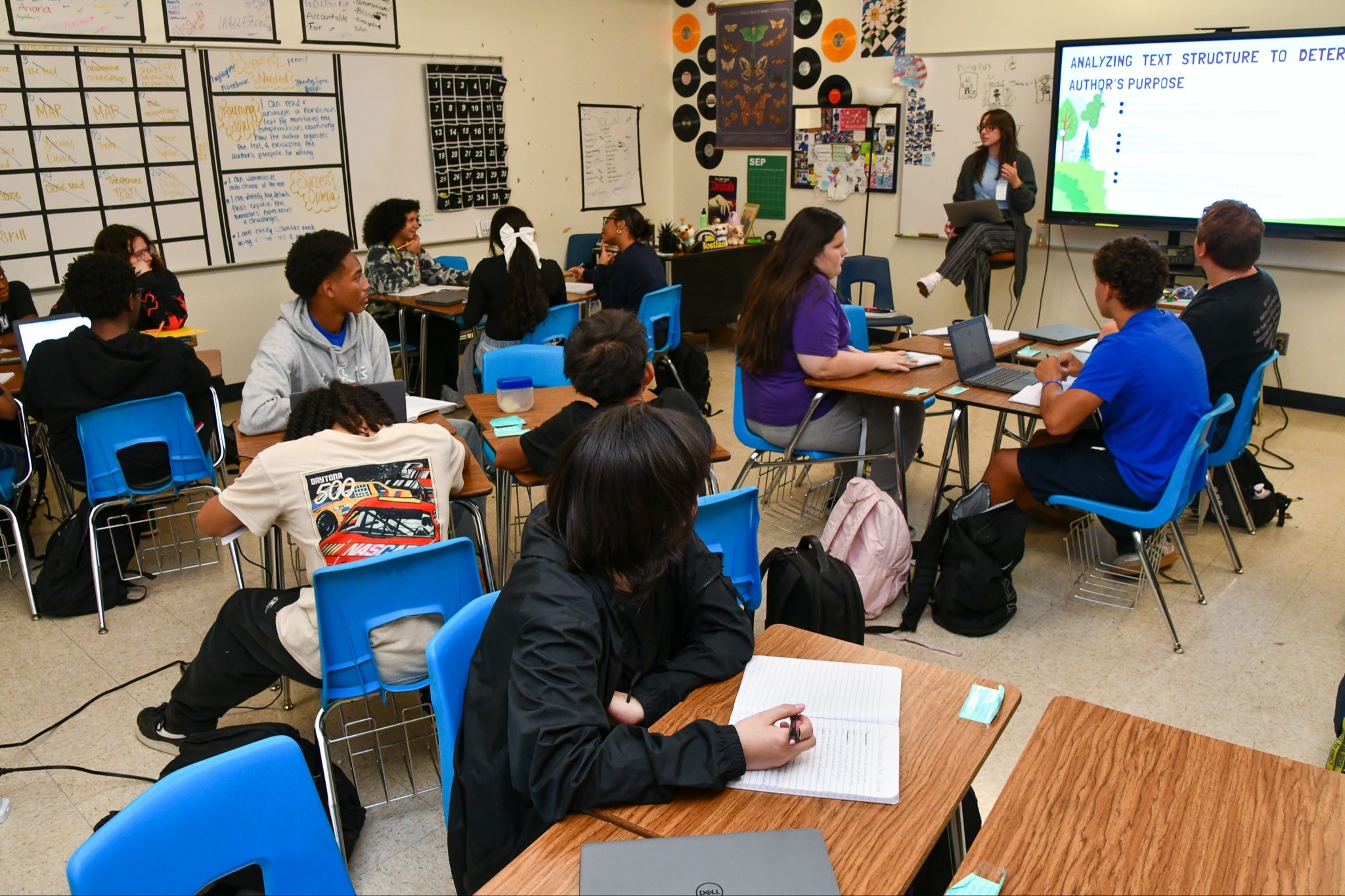 Students listening to a teacher give a lesson