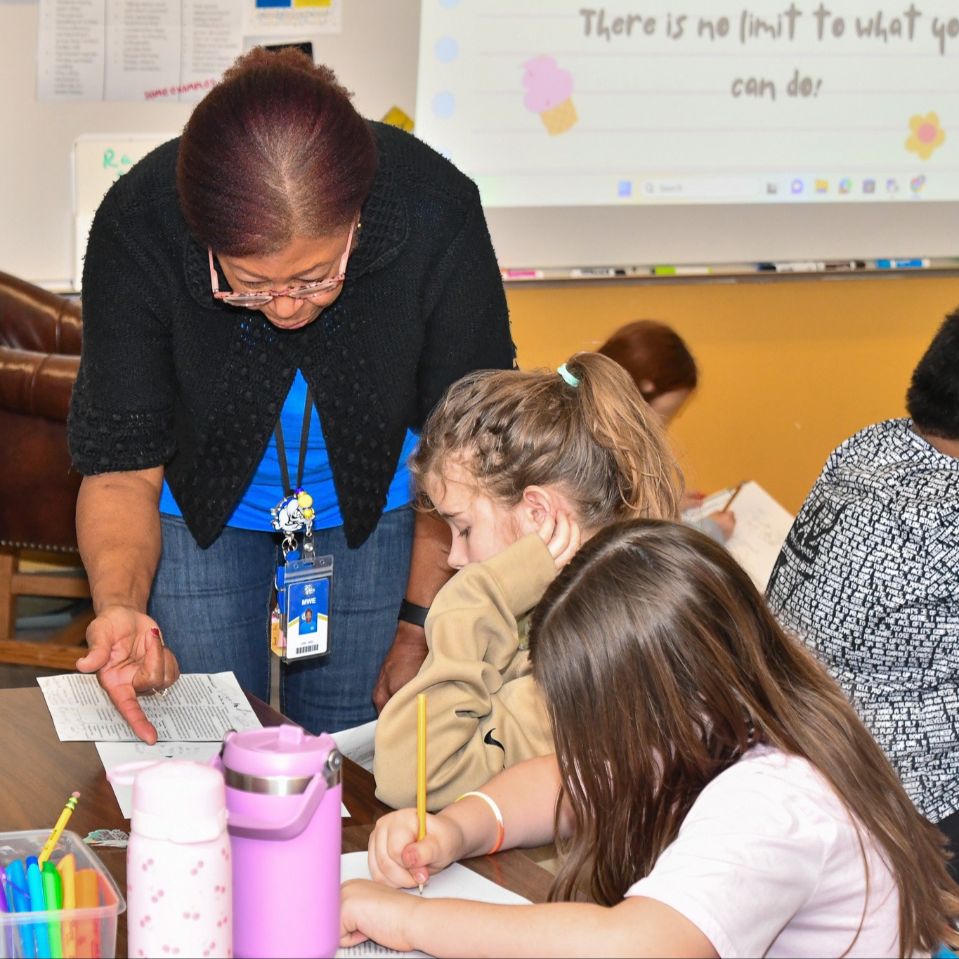 Teacher helping student on activity
