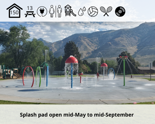 splash pad with water running and mountains in the background