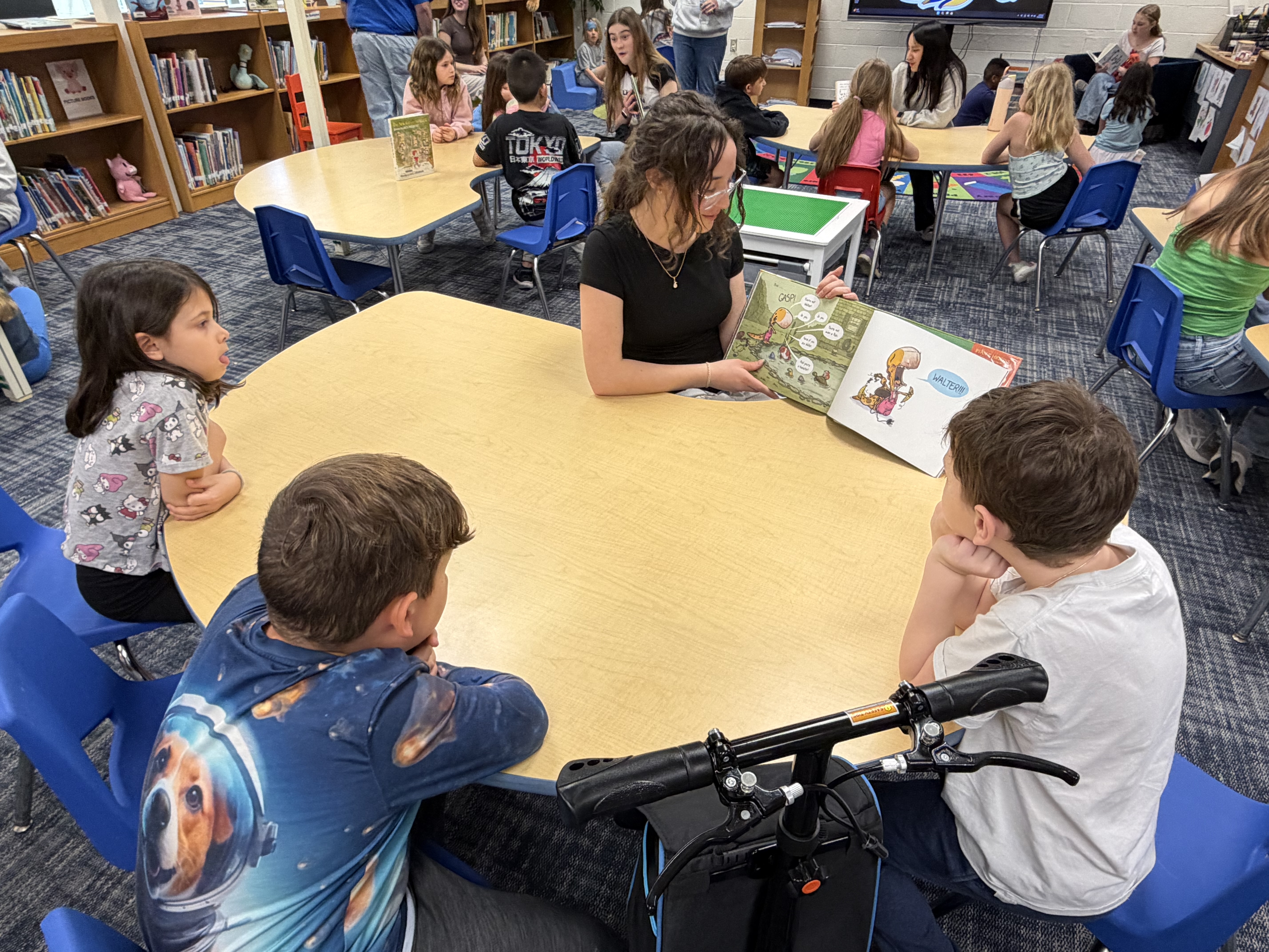 7th Grader Reading to elementary students for read across America