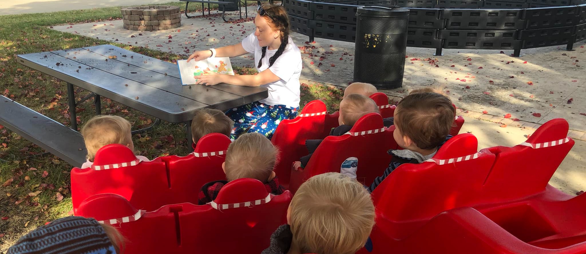 teacher reading to toddlers