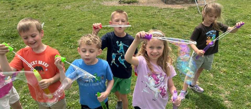kids blowing bubbles 