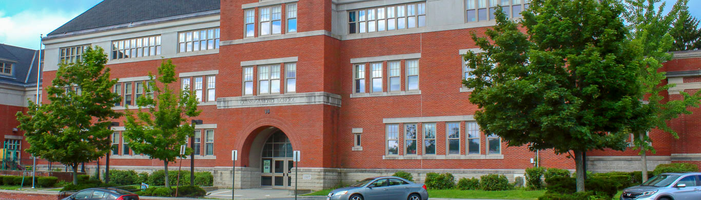 Quinsigamond Red brick multistory building full of windows