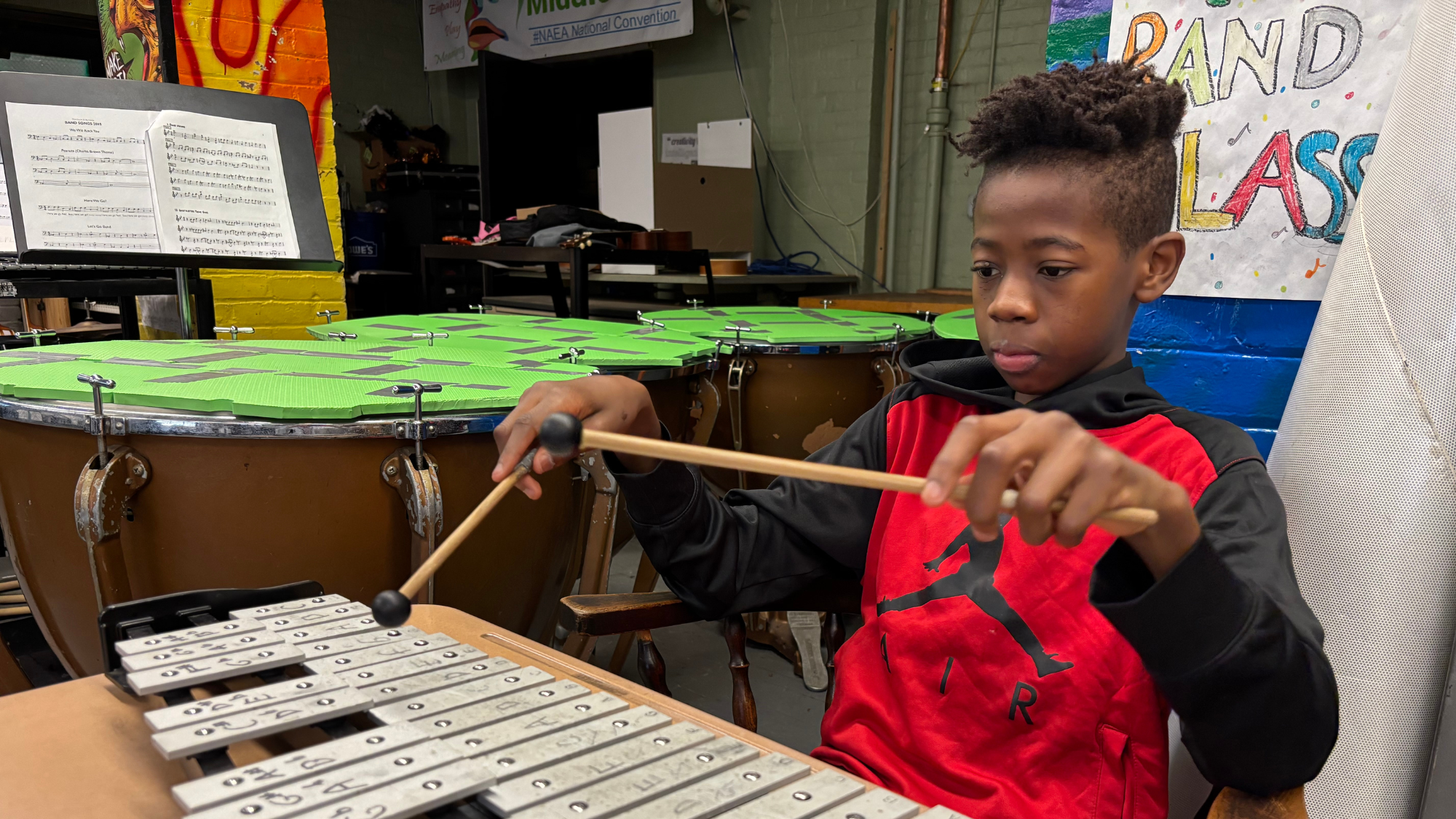 A boy playing xylophone