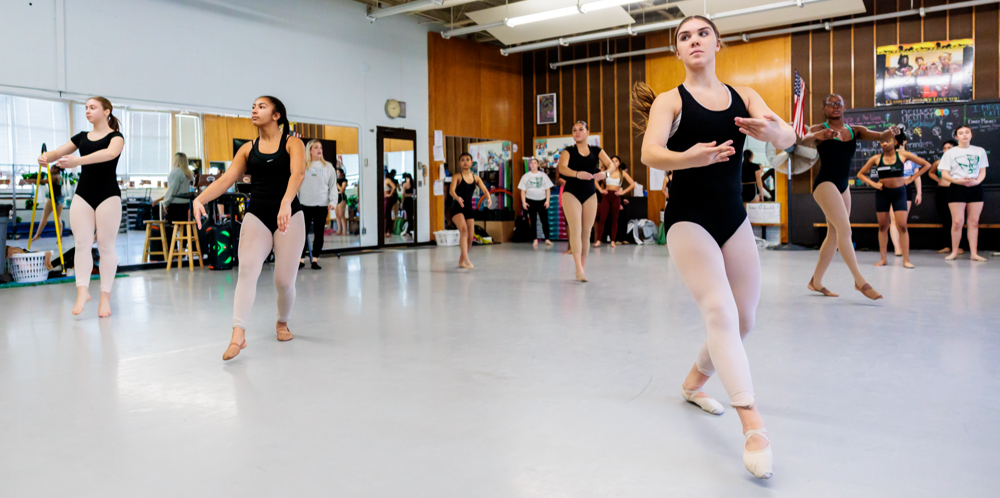 Students in the Burncoat magnet dance program warm up before practice.