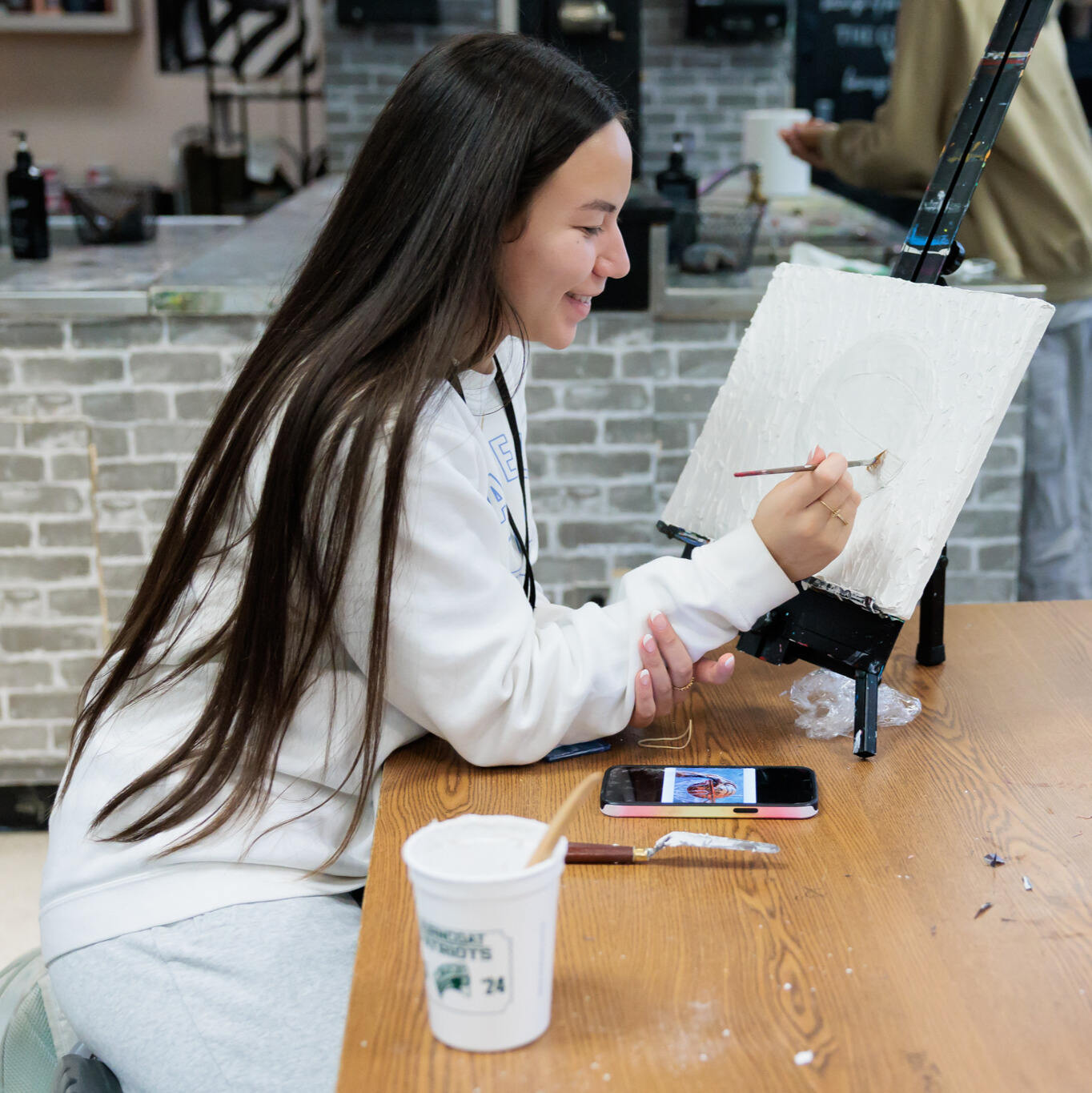 A student works on an art project.