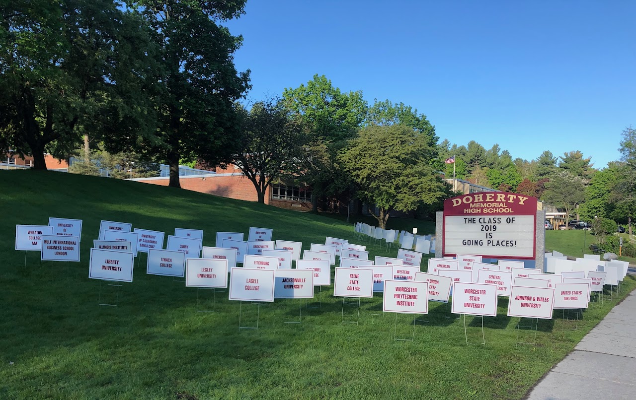 Doherty Memorial welcome sign on their main yard full of posters.