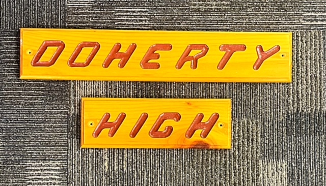 2-piece wooden sign that say Doherty High