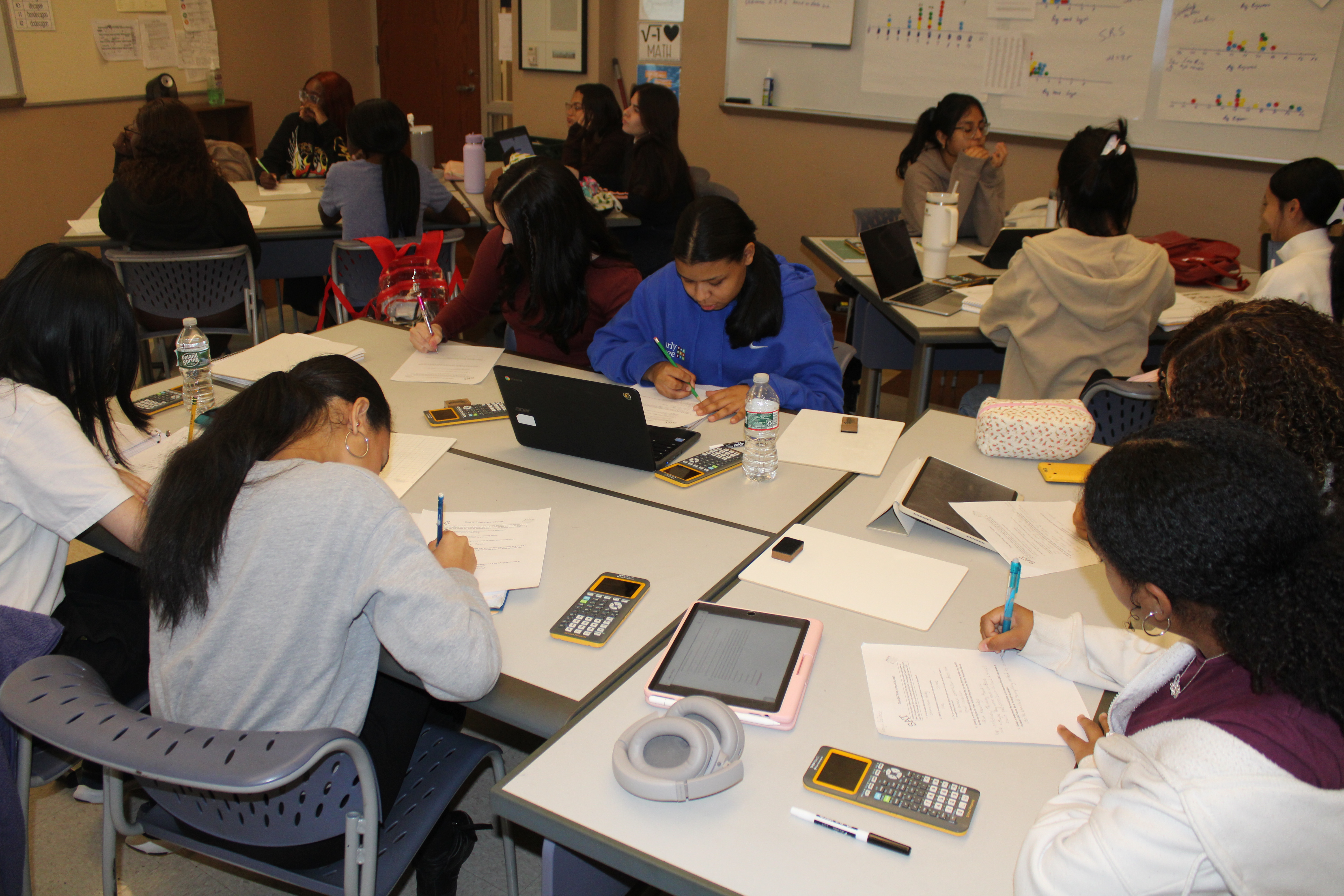 Group of students working independently on a math assignment.