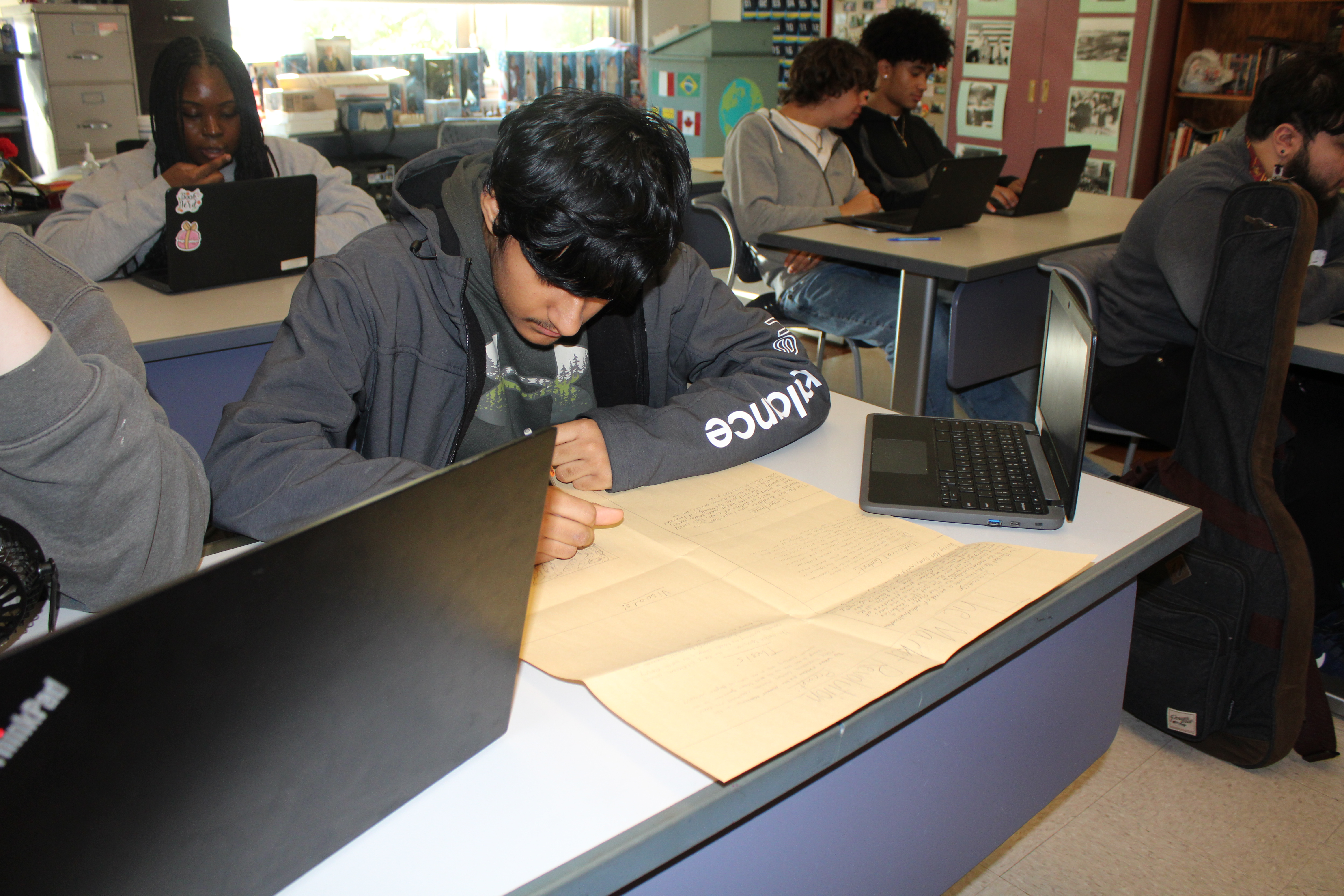 Student working on his history poster.