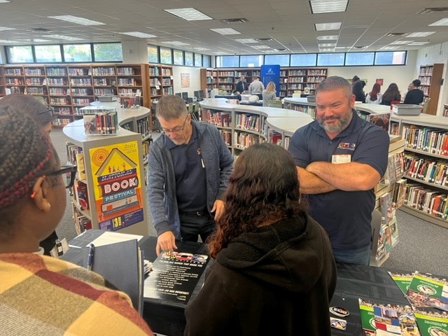 Students talking to businesses