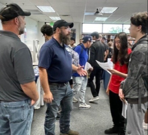Students connecting with local business partners
