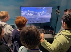 Students learning flight simulator technology