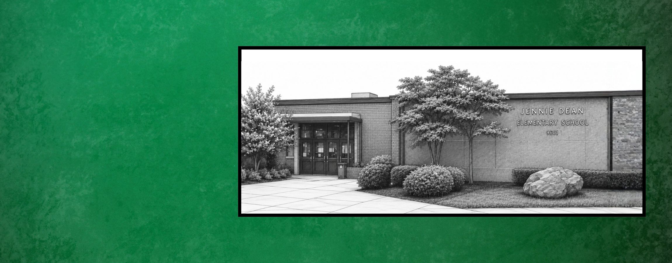 The exterior of Jennie Dean Elementary School with a brick facade and a large stone boulder in front.
