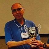 man holding a trophy