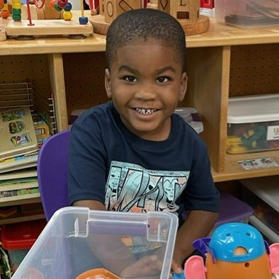 student playing with toys
