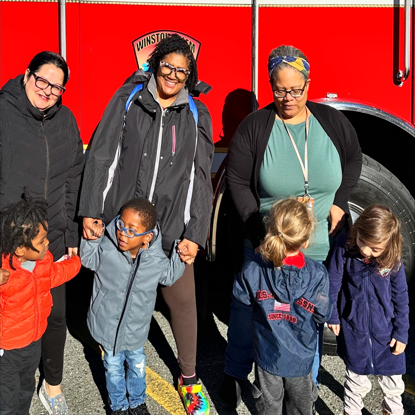 class in front of fire truck